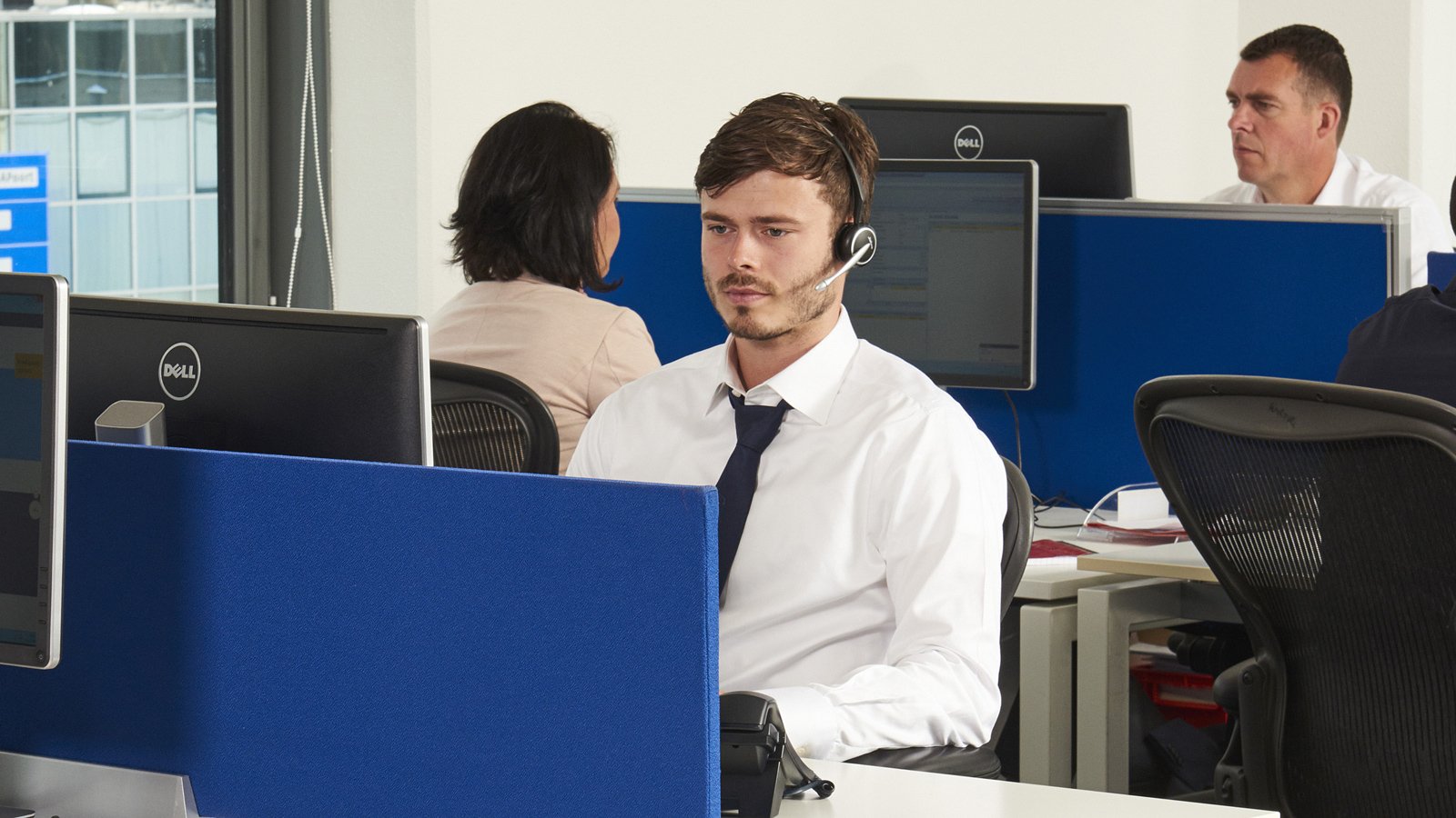 Guy working at his desk (accounts receivable management)
